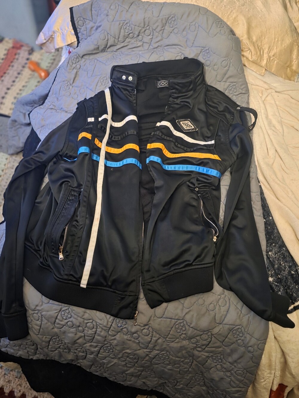 COOGI Black Bomber Jacket with Blue and Yellow Stripes